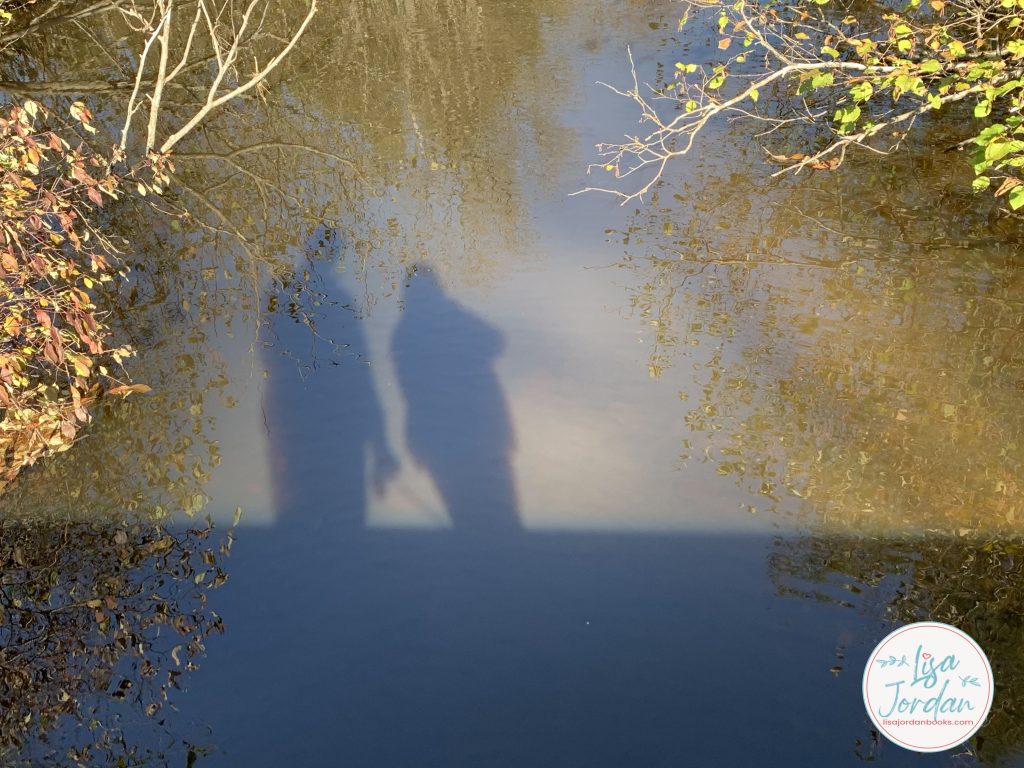 Silhouette of a couple on the water