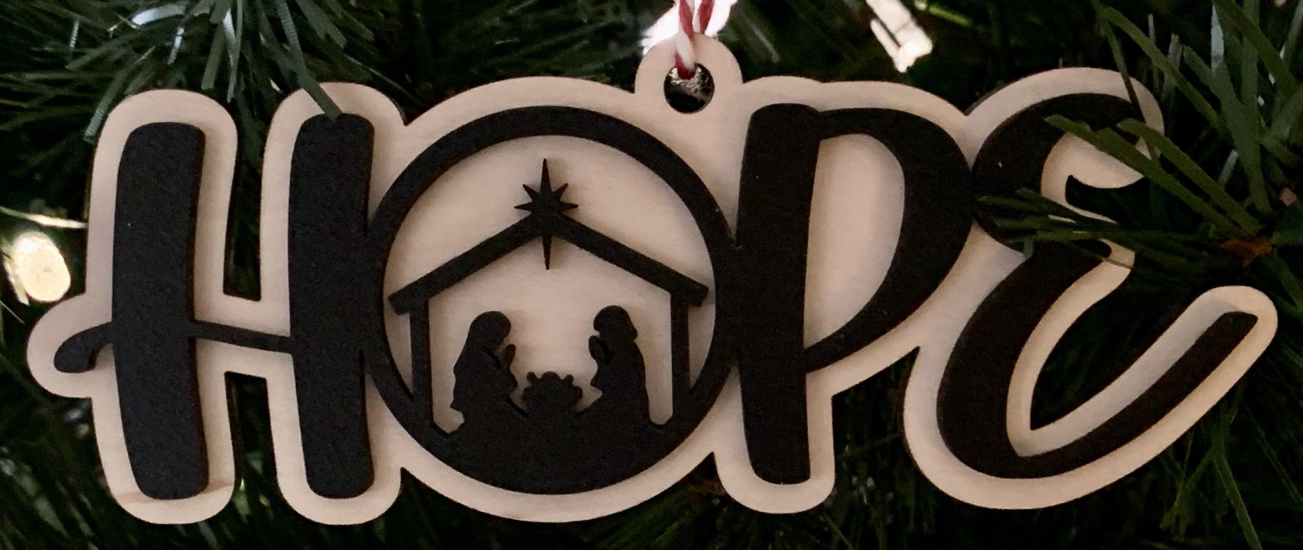 Hope ornament with a nativity nestled in the O